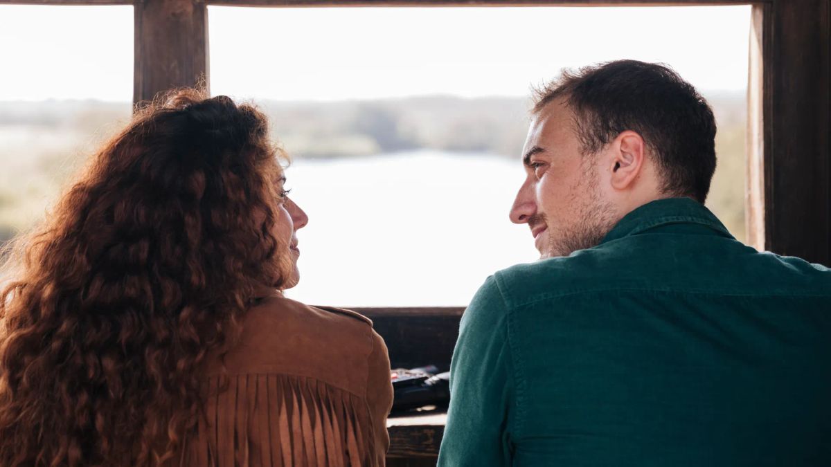 Couple sharing a quiet moment together by a window